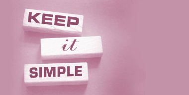 Keep it simple words on wooden blocks. Business copy writing concept. 