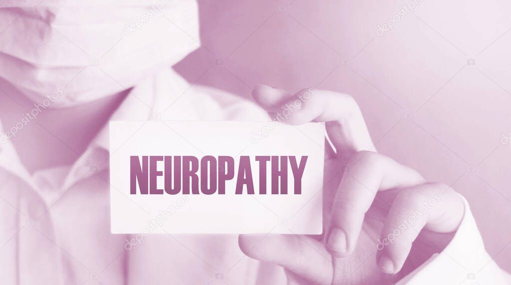 Doctor keeps a card with the name of the diagnosis - neuropathy. Selective focus. Medical concept.