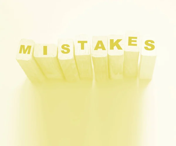 MISTAKES word made with building blocks. Business startup or medical healthcare concept.