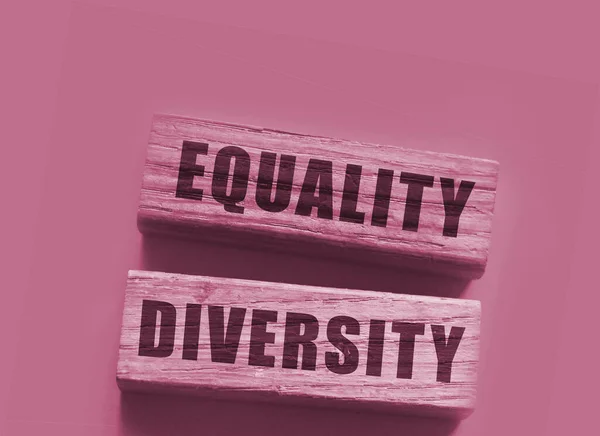 Equality diversity words written on wood blocks. Equality and diversity for gender age and sexual orientanion concept.
