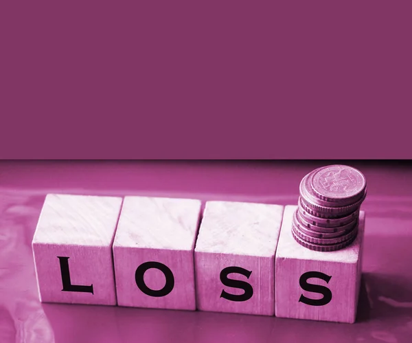 Wooden cubes with LOSS word on wooden table. Financial loss busines concept. Memory loss demetia mental health concept.