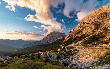 Sunset evening panorama view from Valparola Pass with Cunturines Spitze Piz dles Conturines in background. Dolomites Mountains, Passo Valparola, Cortina d'Ampezzo, Italy