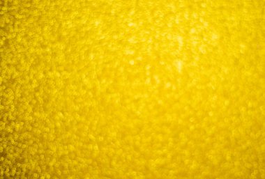 Altın rengi pulların bulanık, pırıl pırıl arka planı. Gümüş parıltı, soyut bokeh dokusu. Çizim tasarımı. Noel için parlak duvar kağıtları. Parti zamanı.