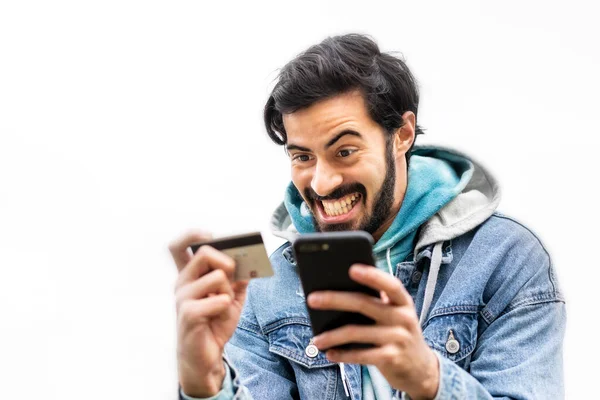 Latin Man Using Credit Card Make Online Payment Smartphone Mixed —  Fotos de Stock