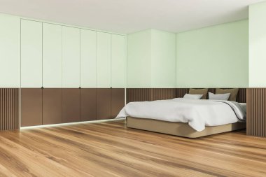 Yeşilin yumuşak tonlarında moda yatak odasının iç tasarımı. Ahşap zemin, bodrum çıkıntısı, rahat yatak ve yaratıcı gardırop. Köşe manzarası. Modern bir daire konsepti. 3d oluşturma