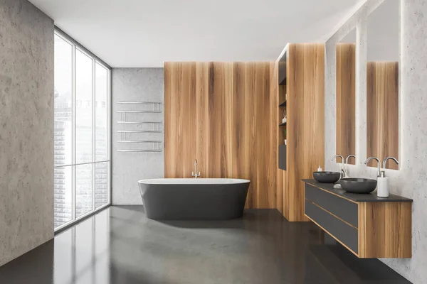 Panoramic bathroom interior with dark grey, noise marble and bright wood materials, a tub, two sinks, an elegant rack and concrete flooring. A concept of on trend design. 3d rendering