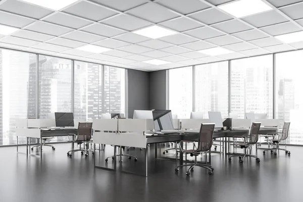 Light office room interior with armchairs and computers on the tables, side view, panoramic windows on Moscow city skyscrapers. Manager workplace with concrete dark floor, 3D rendering