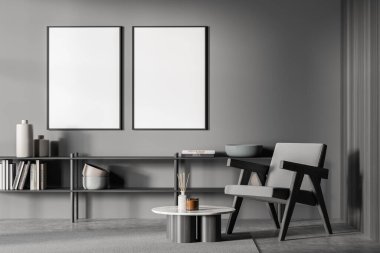 Oturma odasının duvarında iki boş çerçeve var. Gri tasarım, düşük raf, kolay koltuk ve yuvarlak sehpa kullanarak, halının üzerinde duruyor. Beton zemin. Modelleme. Modern ev dekorasyonu kavramı. 3d oluşturma