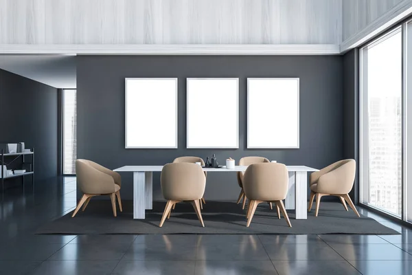 Three empty canvases in the grey dining room interior with beige chairs, a table and a sideboard in a hallway. Tiled floor. A concept of modern home and hotel design. 3d rendering