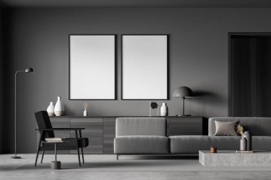 Moda detayları, ahşap malzemeler, beton döşeme, kanepe ve kolay koltuk üzerine kurulu koyu gri oturma odasındaki iki boş tuval. Model yap. Minimalist tasarım konsepti. 3d oluşturma