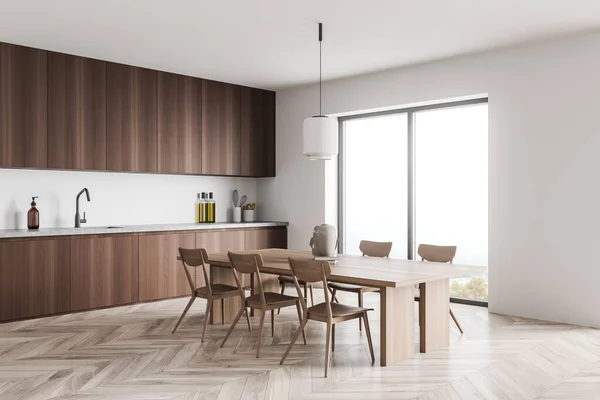 Küchenecke Aus Minimalistischem Dunklem Holz Mit Hellem Esstisch Mit Sechs — Stockfoto