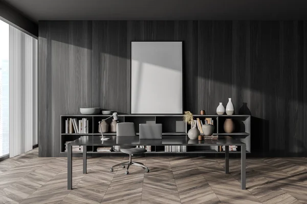 Empty canvas standing next to black wood wall in manager office interior with simple grey desk, office chair, parquet floor, sideboard and vertical blinds. Mock up. Concept of workspace. 3d rendering