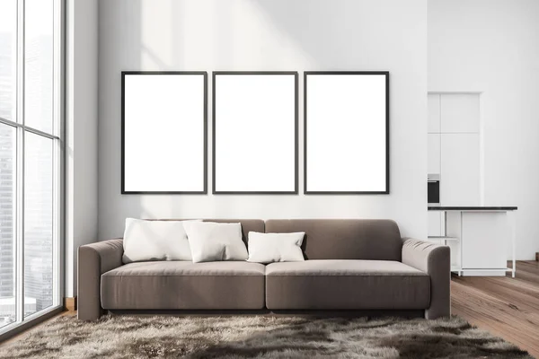 三幅造型油画挂在墙上 舒适的客厅里 靠近全景窗户和地毯的褐色沙发 背景为白色厨房 木地板 现代室内设计理念 3D渲染 — 图库照片