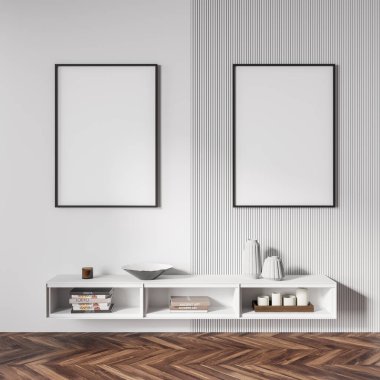 Beyaz raflı, minimalist dekorasyonlu, kitaplı mumlar, parke zemin. Beyaz duvardaki iki boş tuval kopyalama alanı, 3B görüntüleme