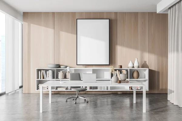 Empty canvas on wood wall in manager office interior with simple white desk, grey office chair, matching concrete floor, sideboard and vertical blinds. Mock up. Concept of working place. 3d rendering