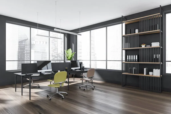 Corner of panoramic grey office with dark wood floor and workstation, having four stylish yellow and light brown office chairs. Concept of modern working place. 3d rendering