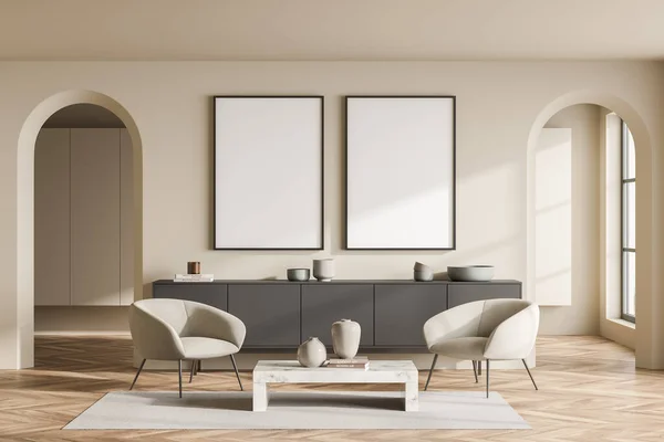 Two mockup canvases in living room with two armchairs and arch doorways, creating symmetrical balance in beige interior design, using grey sideboard and parquet. Concept of seating idea. 3d rendering