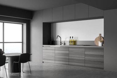 Koyu renk mutfak odasının içi gri duvar, dolap, lavabo, panoramik pencere, elektrikli fırın, sıvı sabun, masa ve beton zemin. Çağdaş minimalist tasarım. 3d oluşturma