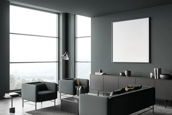 Modern interior design with square canvas on dark green living room wall. Corner view of sofa, armchairs, grey sideboard and coffee tables. Concrete floor. Minimalist concept. Mock up. 3d rendering