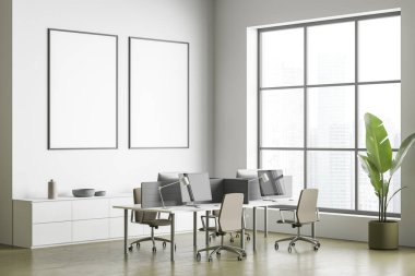 Çalışma masası, beton döşeme ve tavan penceresi olan beyaz ve zeytin odasındaki duvarda iki boş tuval. Model yap. Modern iç tasarım kavramı. Köşe manzarası. 3d oluşturma