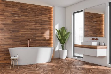 Banyonun iç tarafında oval beyaz küvet, yüzen kibir ve moda taburesi var. Modern apartman tasarımı kavramı, ahşap görünümlü fayanslı duvar ve parke tarzı zemin. 3d oluşturma