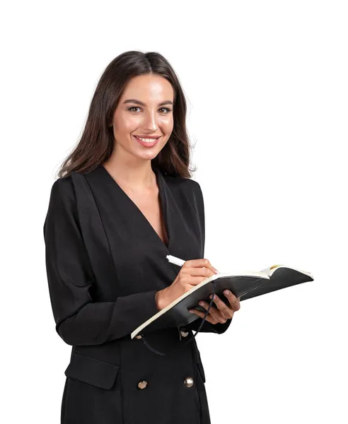 穿着正式黑色夹克套装的迷人的年轻 微笑的女商人拿着笔记本记笔记 妇女参与商业概念 与白人背景隔离 — 图库照片