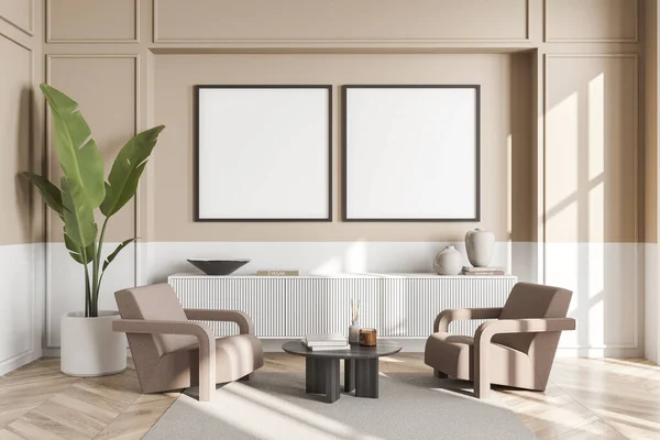 Two square canvases on beige wall with white basement. Living room interior with armchairs, sideboard, coffee table, rug and parquet floor. Concept of modern design. Mock up. 3d rendering