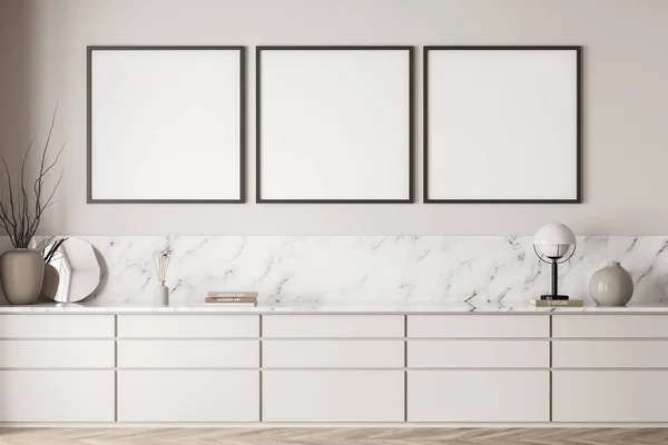 Three empty square canvases in white corridor interior with extra large sideboard design, using marble detail. Concept of modern wall art. Mock up. 3d rendering
