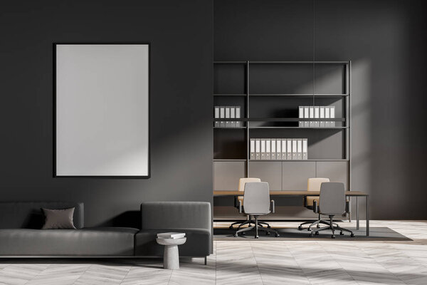 Холст-макет на стене тёмно-серой гостиной с диваном и журнальным столиком. Конференц-зал с полками на заднем плане. Бетонный пол. Концепция современного офисного дизайна. 3d-рендеринг