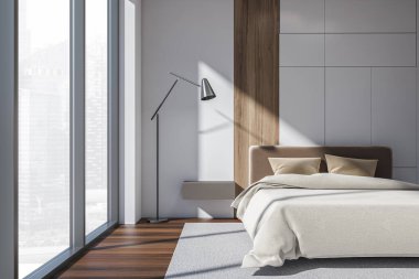 Açık renk yatak odası, bej yatak örtüleri ve yastıklar, ön manzara, gri halı ve şehir manzaralı parke zemin. Yüzen komodin ve lamba, 3D görüntüleme