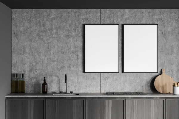 在深灰色和木制厨房的混凝土墙上有两幅空白的油画 现代室内设计与简约的概念 把它弄坏了3D渲染 — 图库照片