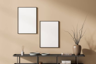 Siyah askılı, minimalist dekorasyonlu, kitaplı seramik tabaklı, sazlık difüzörlü bej bir sanat odası. İki boş çerçeve satırı, 3B görüntüleme