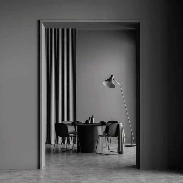 Doorway with modern dining room interior on background. Dark grey design, using round table, four chairs, lamp, curtain and concrete floor. Scandinavian concept. 3d rendering