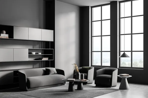 カーペットの上に2つの灰色のアームチェアとソファ グレーのコンクリートの床 装飾付きのコーヒーテーブル付きの暗い客室のインテリア 田舎の棚とパノラマの窓 3Dレンダリング — ストック写真