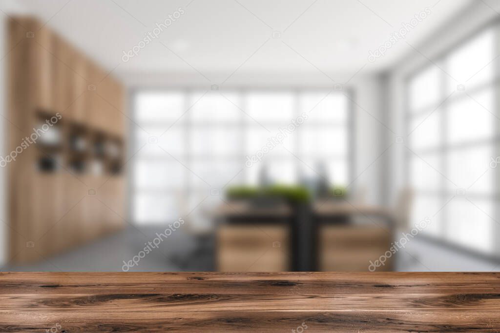 Wooden table for product display with blurred office on background. White and grey interior design, using wood materials and combined desk. Closeup. Concept of commercial exhibition. 3d rendering
