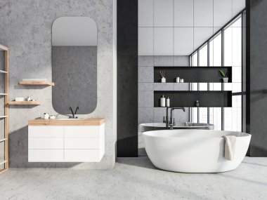 Yuvarlak aynalı gri beton banyo ve yüzen kibrin üzerinde iki küçük raf. Küvet bölgesindeki ayna duvarlı fayanslar özel detaylarla dolu. Modern iç tasarım kavramı. 3d oluşturma
