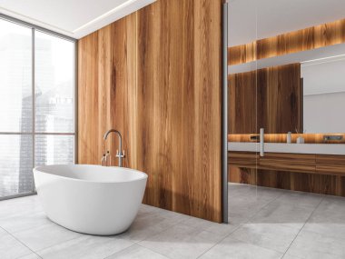 Ahşap duvarlı modern beyaz banyonun köşesi, serbest banyo küveti, döşemeli döşeme ve arka planda raf kibri. Çağdaş iç mekan tasarımı kavramı. 3d oluşturma