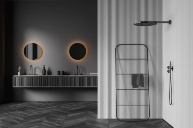 Dark stylish bathroom interior with white corner with douche, two sinks with round mirrors, towel rail ladder on black parquet floor, 3D rendering