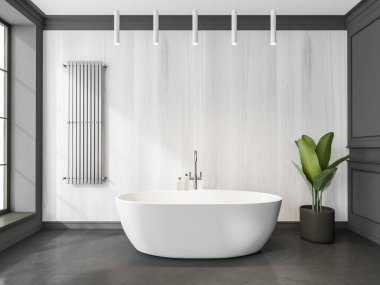 Banyo içi yuvarlak seramik küvetli çelik havlu askılı beyaz ahşap duvarlı, gri beton zemin ve kolye lambalı. Modern ev tasarımı kavramı. 3d oluşturma