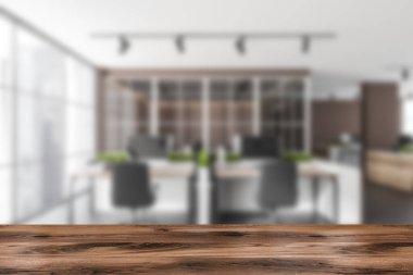 Ön planda ahşap masa, ofis içi arka planı koltuklar ve bilgisayarlar, ortak çalışma alanı. Ürünün gösterimi için maket, 3B görüntüleme