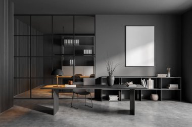 İçi boş beyaz posteri, masası, rahat koltuğu, dizüstü bilgisayarı ve beton zemini olan karanlık ofis odası. Çalışma süreci için mükemmel bir yer. Minimalist tasarım. Model yap. 3d oluşturma