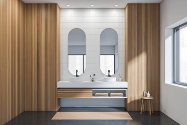 Banyonun içinde iki lavabo ve güvertede aksesuarları olan ayrı aynalar, ön görüş, ayak havlusu olan gri beton zemin, şehir manzaralı pencere, 3D görüntüleme.
