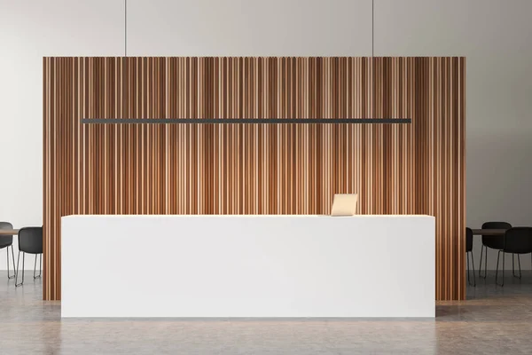 White reception stand, linear light, concrete floor and wood panel wall with meeting room interior on background. Concept of modern office design. 3d rendering