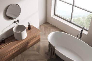 Parlak banyo manzaralı, pencereli, kırsal manzaralı, küvetli, yuvarlak aynalı, lavabolu, beyaz duvarlı ve meşe ağacından parke zeminli. Hijyenik ve spa prosedürleri kavramı. 3d oluşturma