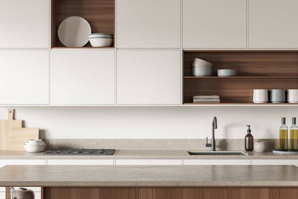 White and wooden cooking room interior with table and deck with oil bottle, soap and sink. Stove with plate and rack with dishes, front view. Cooking space in modern apartment, 3D rendering