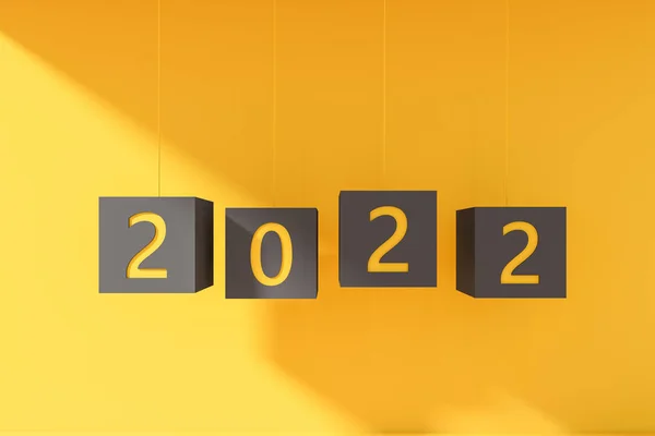 2022年新年の文字列にぶら下がっている 黄色の背景に数字と黒のキューブ お祝いと計画の概念 3Dレンダリング — ストック写真