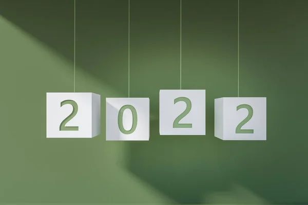 2022年新年の文字列にぶら下がっている 緑色の背景に数字が付いた白い立方体 将来の計画と人生の目標の概念 3Dレンダリング — ストック写真