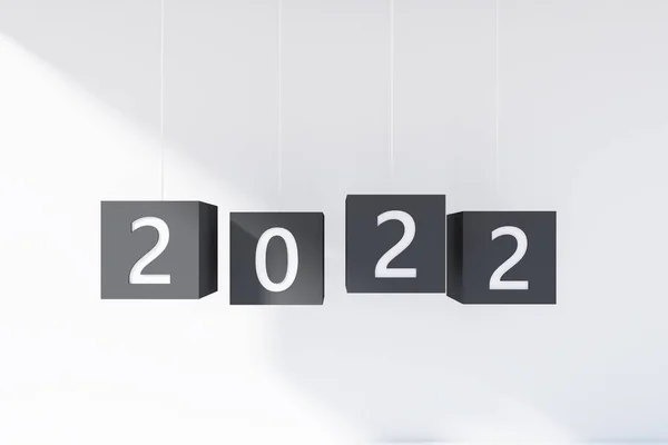 2022年の文字列にぶら下がっている 白い背景に数字の黒い立方体 お祝いと休日の概念 3Dレンダリング — ストック写真