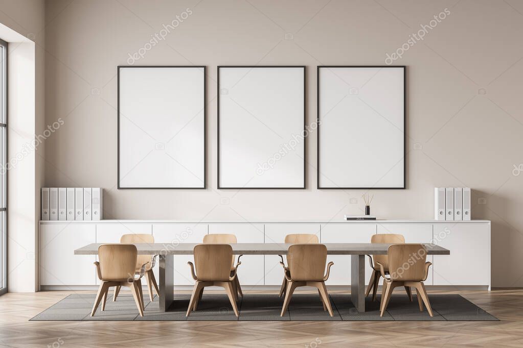 Beige conference room interior with eight chairs and wooden table on carpet, parquet floor. Meeting room with long drawer and business folders. Three mock up frames on wall, 3D rendering