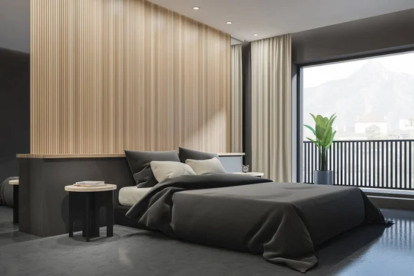 Corner view on dark bedroom interior with bed, panoramic window with curtain, grey walls, wooden partition, concrete floor and bedside. Concept of contemporary apartment design. 3d rendering